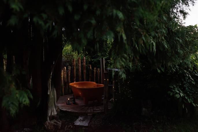 Hot tub with trees and fairy lights 