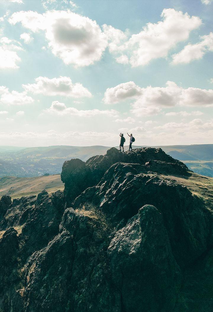 Two people at the top of a hill