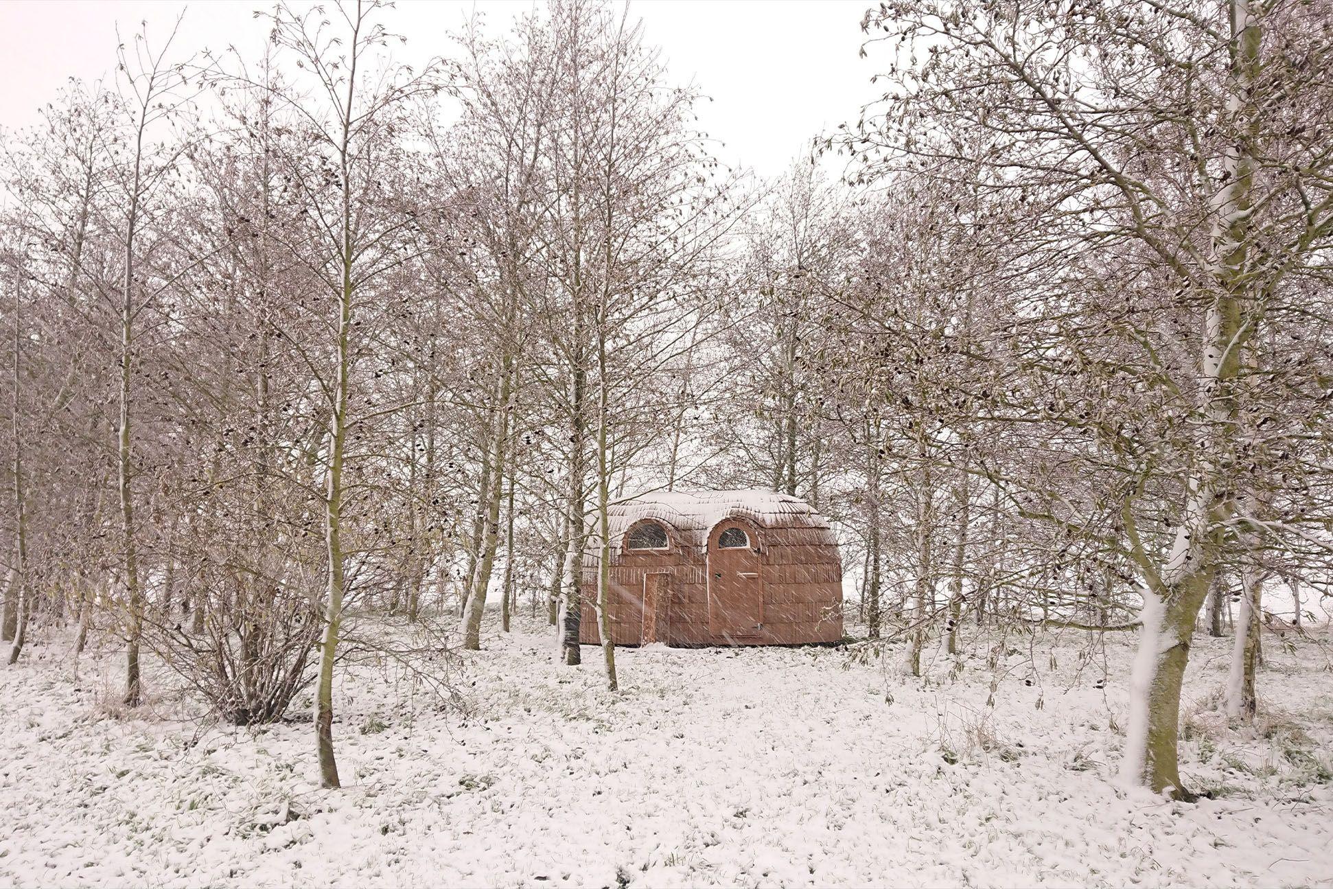 Photo of a cabin in the snow