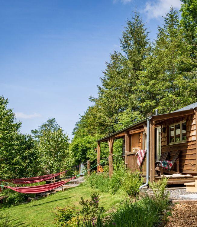 Eco-friendly cabin with a hot tub and hammocks