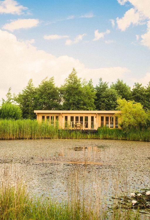 Lodge in front of a lake