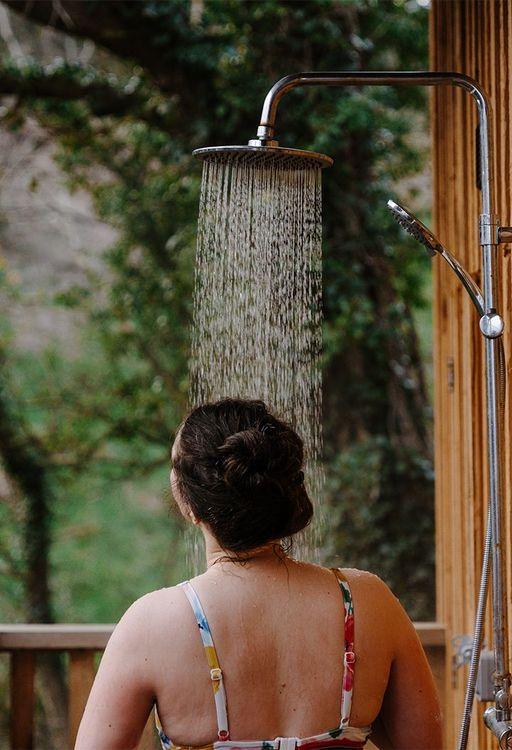 Woman in an outdoor shower