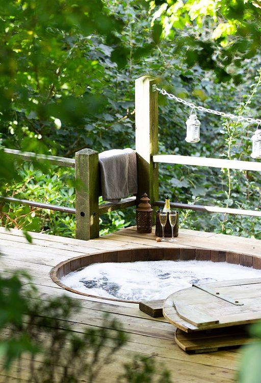 Hot tub built into the deck of a cabin