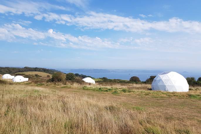 WilderMe geodomes glamping - the geodomes on a sunny day, Kingsand, Cornwall