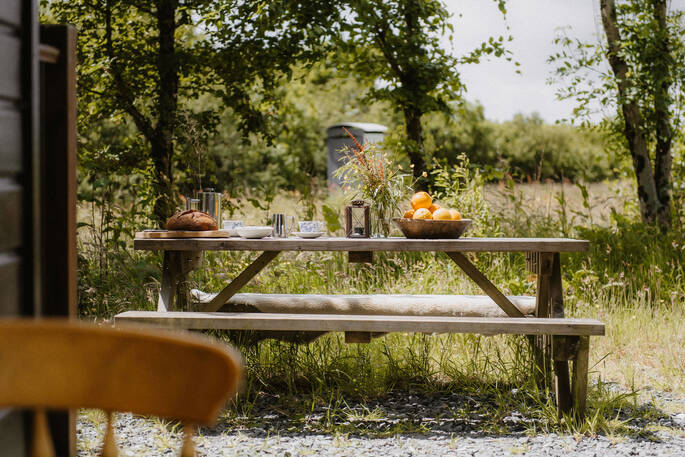 View from picnic bench outside of hut