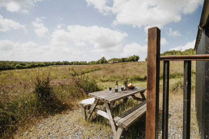 View from picnic bench outside hut