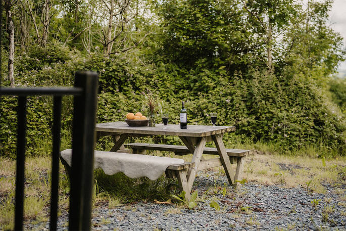 Picnic table outside hut