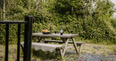 Picnic table outside hut