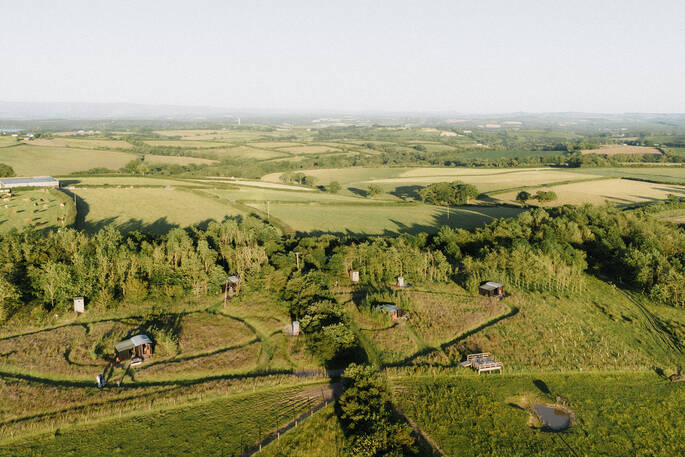 Arial view of huts and site