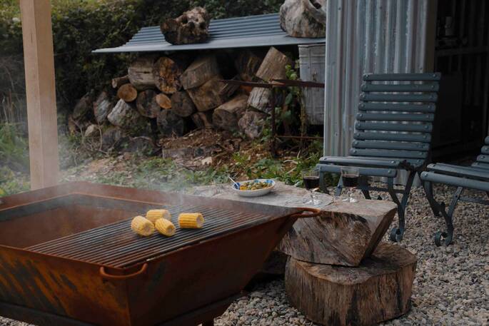 Separate kitchen hut and firepit area