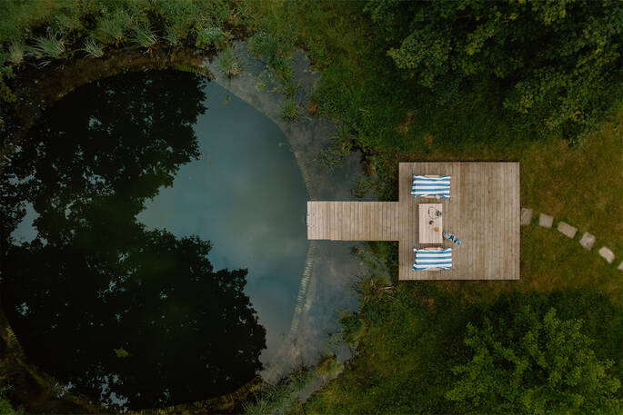 Brick lined swimming pond with spring water