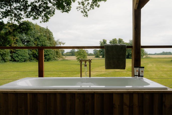 Outdoor bath tub on the deck