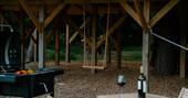 Swing and hammock under the treehouse