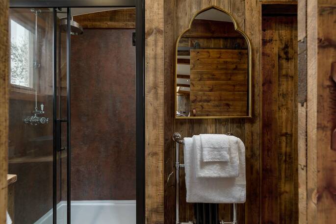 Bathroom with a shower, sink and flushing toilet