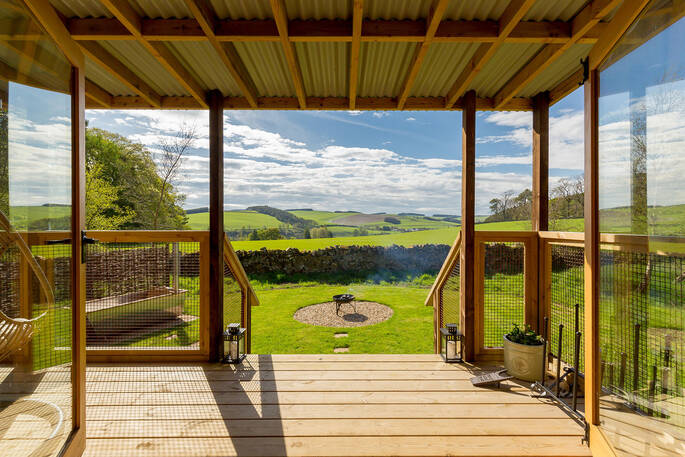 Large front garden with a firepit area