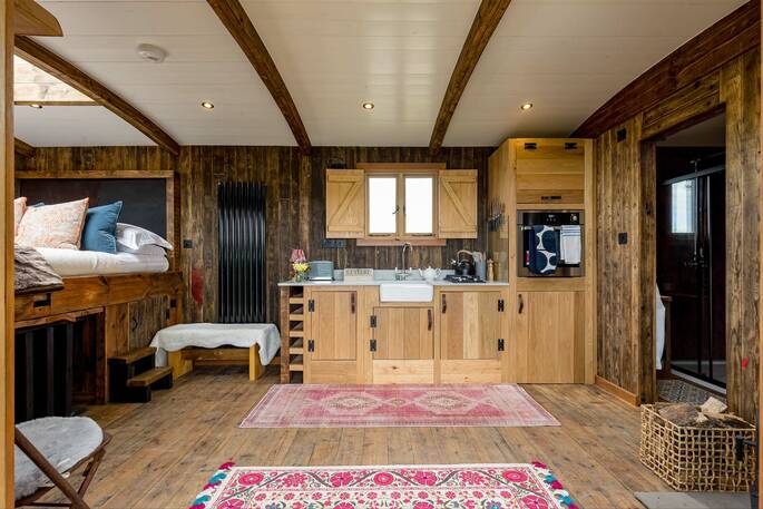 Open-plan kitchen with an oven, kettle, toaster and gas hob