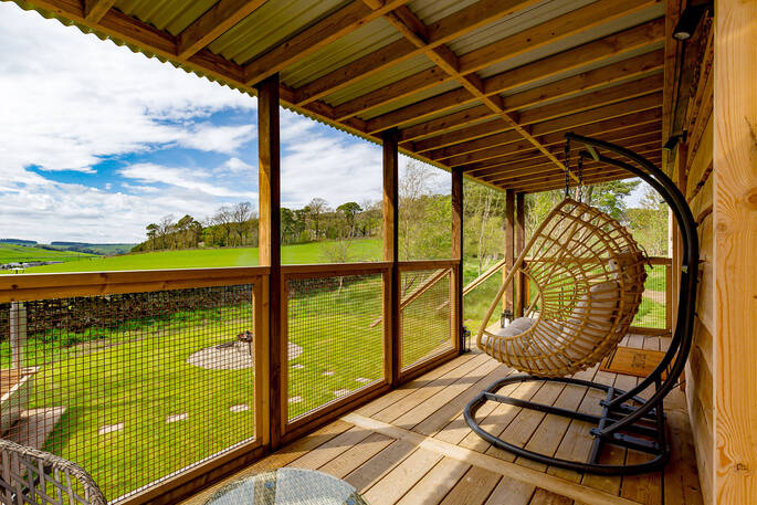 Swing on the deck with a view to the garden