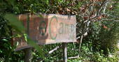 Le Camp wooden entrance sign in France 