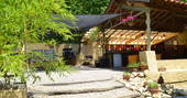 Open plan guest kitchen seen through the bamboo at Le Camp in France 